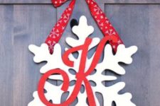 09 snowflake door hanger with a monogram and red ribbon