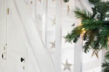 10 evergreen garland with lights and paper stars hanging