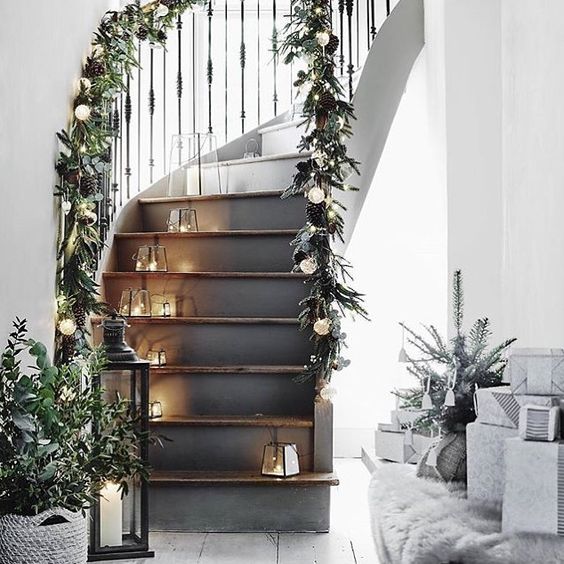 evergreen garland with pinecones and bauble lights