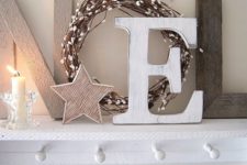 11 neutral Christmas mantel with letters, a candle and a star