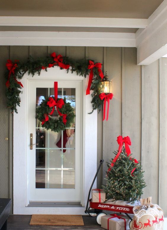 easy and elegant decor with evergreens and red bows, some lights included