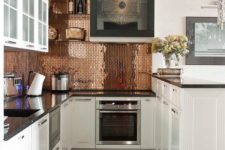 12 tiny copper tiles, marble floors and white cabinets