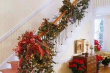 15 fir garland with large pinecones, lights and red ribbon decor