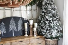 16 a flocked Christmas tree and trees on a chalkboard can be enough for neutral decor