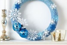 17 a blue an white Christmas wreath with snowflakes and ornaments
