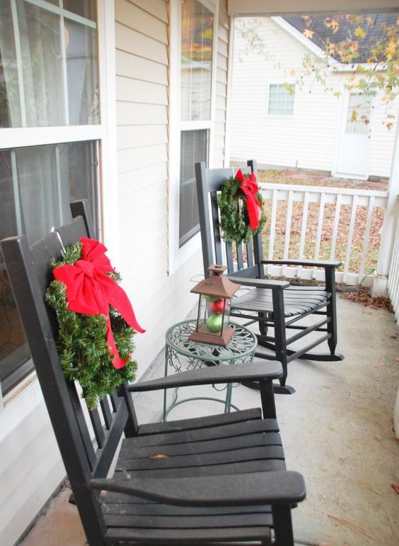 small wreaths with red bows hung on the rockers