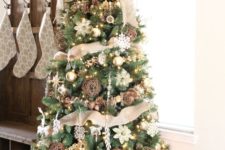 18 a rustic tree decorated with burlap in a galvanized bucket
