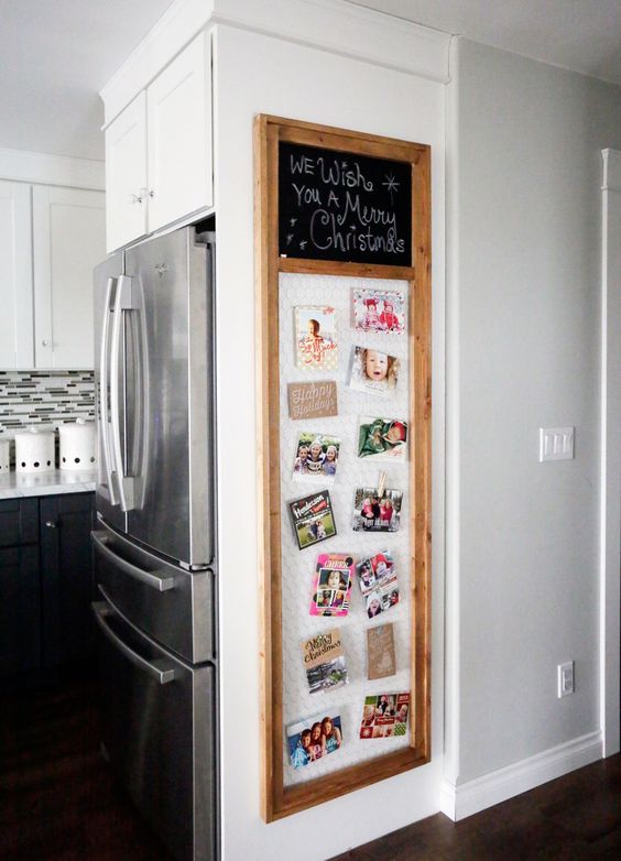 framed wire with cards attached with clothes pins