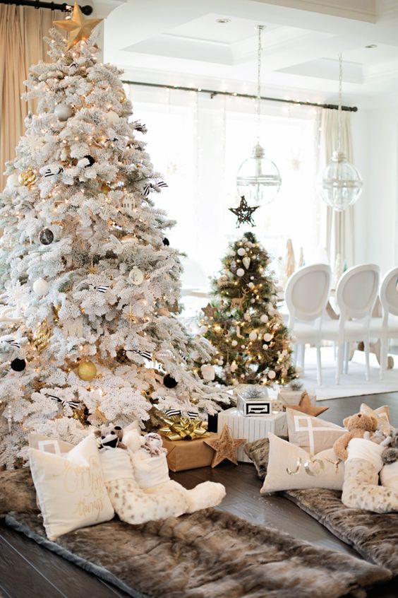 flocked tree with black and gold ornaments