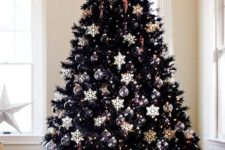 20 chic black christmas tree with black and white ornaments all over makes a bold statement