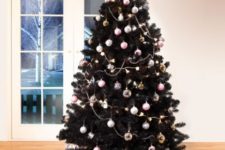 22 decorate your black tree with pastel ornaments to make it look cute and contrasting