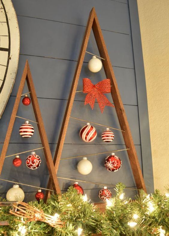 reclaimed wood plank christmas trees with ornaments hanging inside