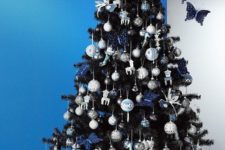 23 navy, white and silver ornaments look good on black trees
