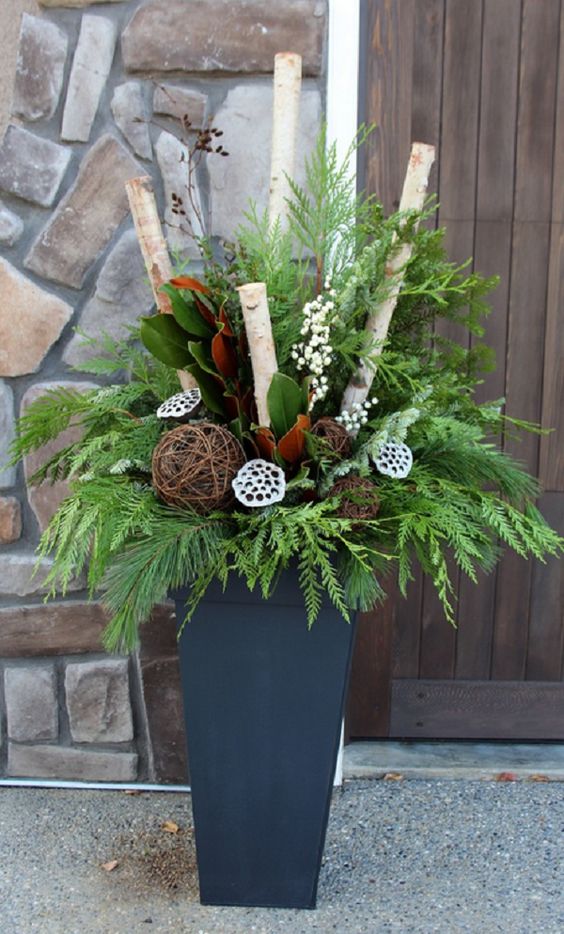 modern grey container with leaves, branches, flowers and lotus