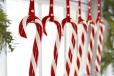 25 candy canes hung on the window