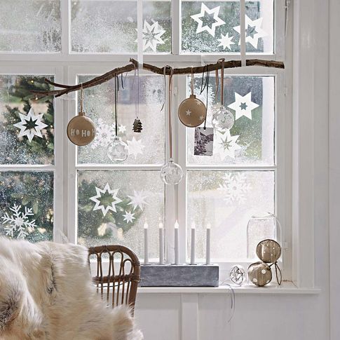 hang a branch and ornaments of various kinds on it, and add paper snowflakes
