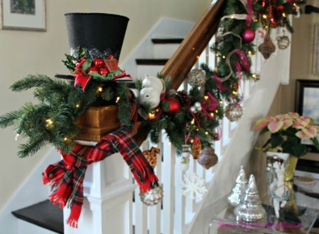 lush Christmas garland with ornaments, lights and plaid fabric