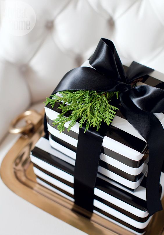 striped black and white gift wraps with a black bow