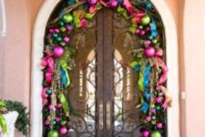 28 super bold Christmas ornament garland over the door