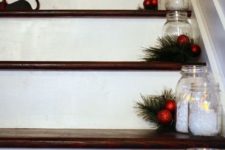 30 evergreens, small red ornaments, candle holders on the steps