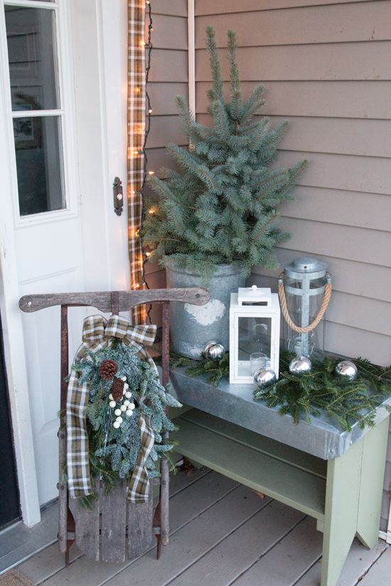 a vintage sleigh, fir branches and silver ornaments