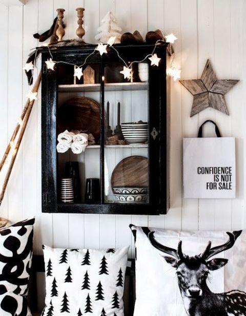 printed monochrome pillows, a white star garland