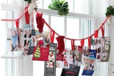 37 holiday card display on a garland with mittens