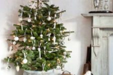 38 put an Xmas tree in a high pot so you can fit presents underneath without obscuring them