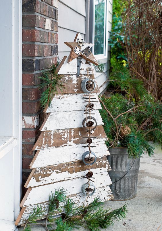 reclaimed wood Christmas tree and star in chippy white boards for a front porch