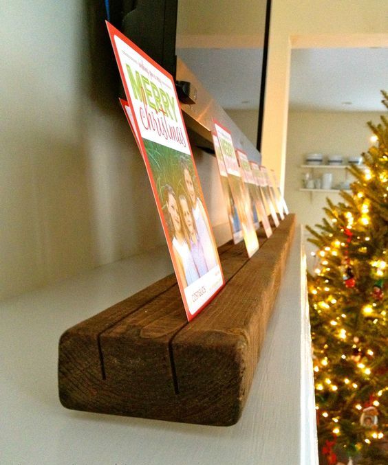 a wooden plank with cutouts and cards in them