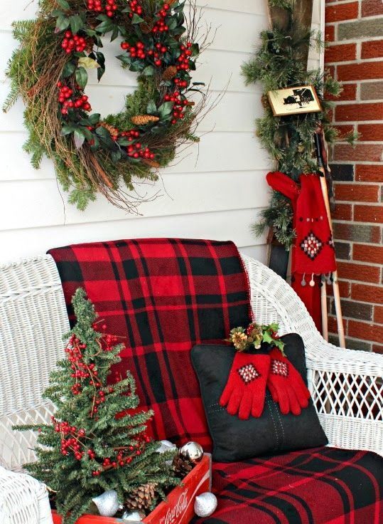 plaid fabric, a red crate and a traditional yet messy wreath