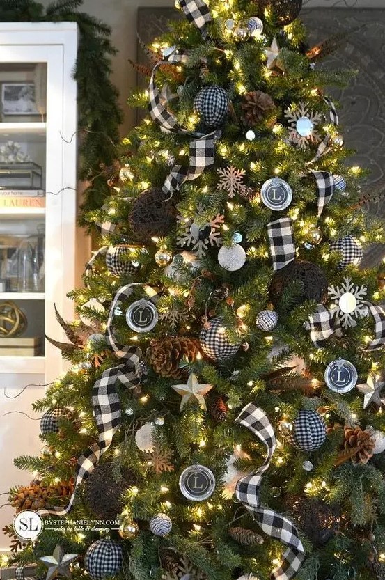 a beautiful Christmas tree with buffalo check ribbons, matching ornaments, yarn balls, pinecones, monograms, snowflakes and lights