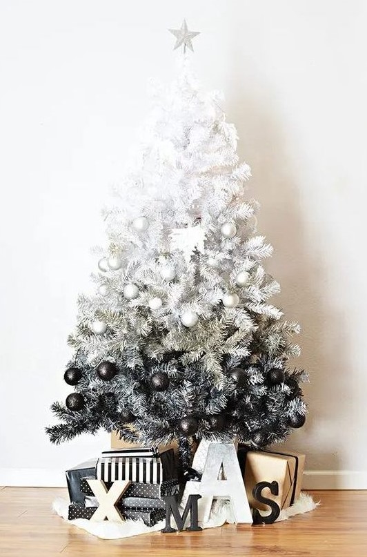 a gorgeous ombre white to black Christmas tree with perfectly matching ornaments and Xmas letters under the tree is a bold idea