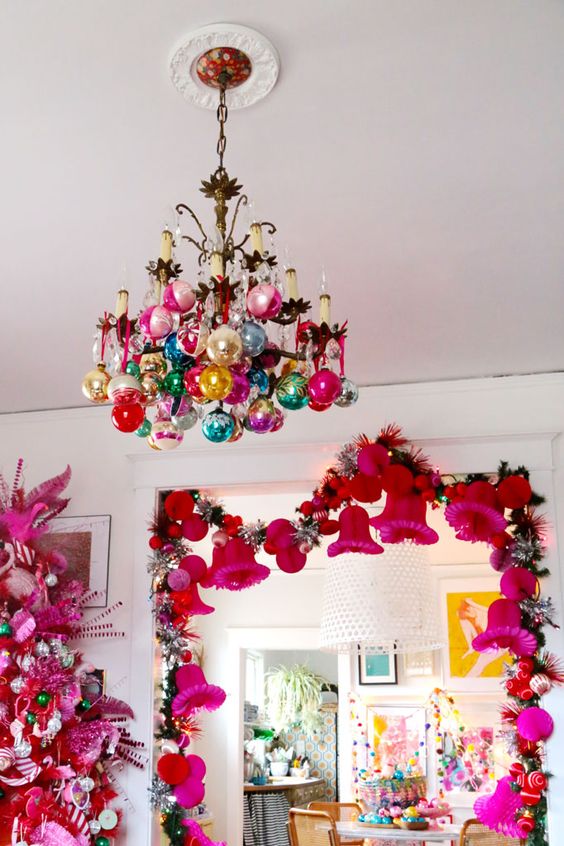 a vintage chandelier with colorful ornaments is a cool and catchy idea for a bright and color-filled space