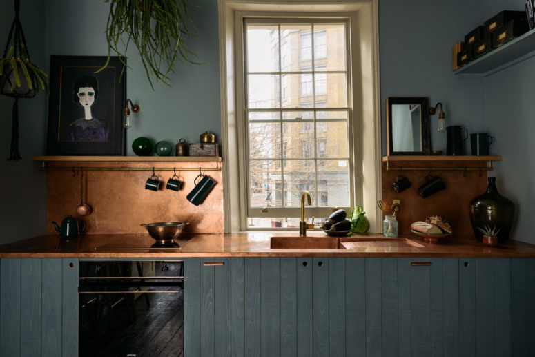 turquoise color is a perfect choice for kitchen cabinets if you've decided to go with a copper backsplash (deVOL Kitchens)