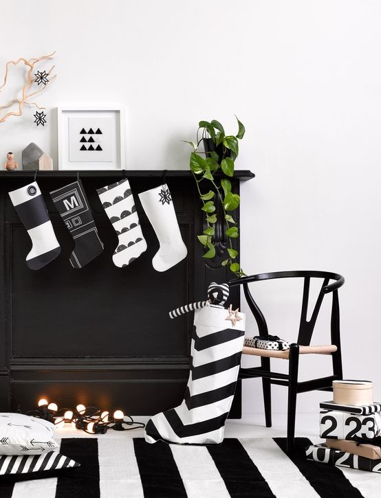 cute modern black and white Cchristmas stockings are perfect to decorate a mantel