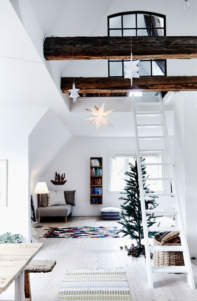 This modern Danish loft with double ceilings has a truly Scandinavian look and is decorated for the winter holidays This modern Danish loft with double ceilings has a truly Scandinavian look and is decorated for the winter holidays