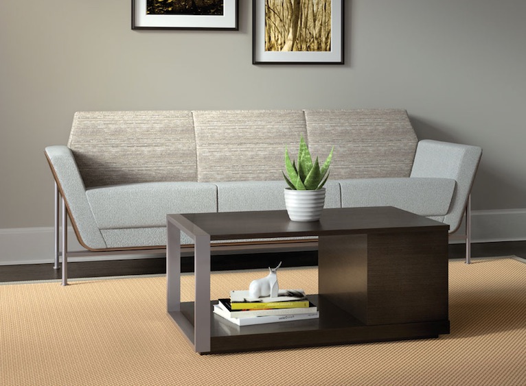 coffee table The coffee table is a dark one with a minimalist look, and the light-colored sofa is with sharp angles