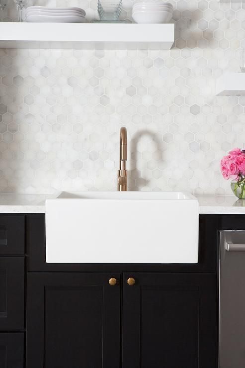 black and white kitchen with an elegant marble hexx tile backsplash