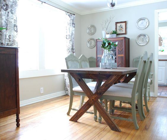 dark-stained wooden table and aqua-colored chairs