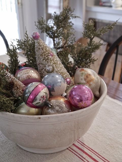 bowl with vintage glass ornaments on display