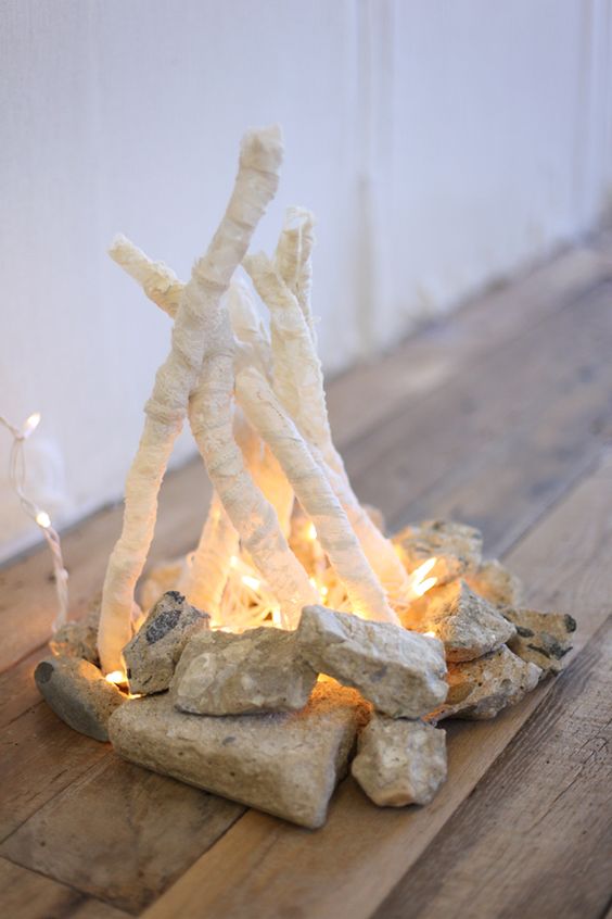 chic white flameless fire pit with stones