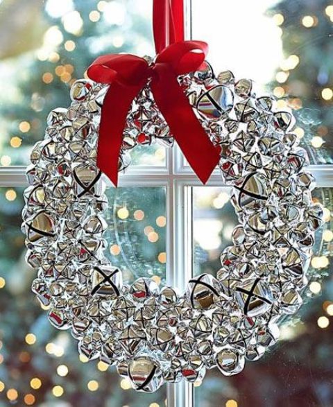 silver jingle bells wreath with a red bow