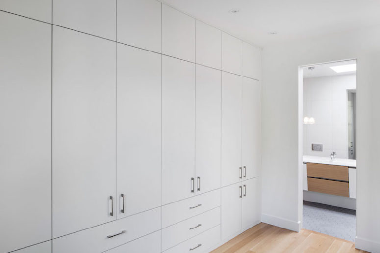 bedroom storage A large wall unit occupies an entire wall in the master bedroom, offering lots of storage