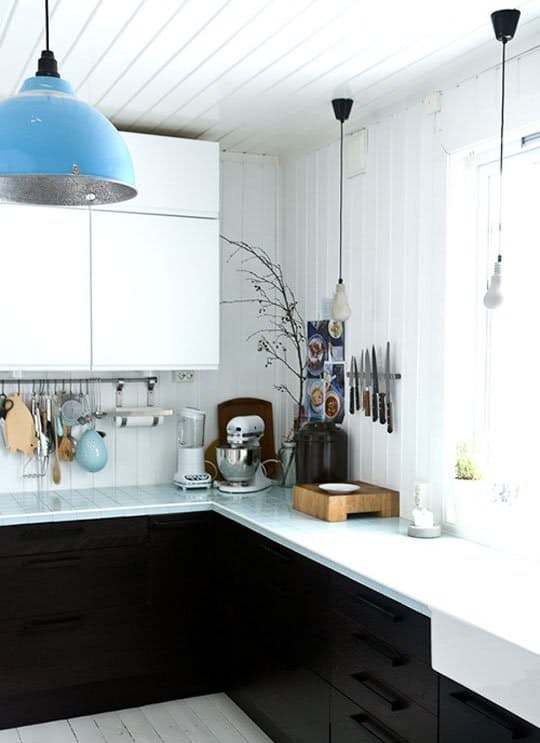 modern farmhouse kitchen with tiles continuing from the walls to countertops