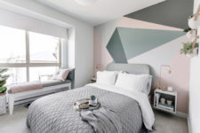 09 Another bedroom has an accent headboard wall with geometric shapes and a cozy windowsill bed for enjoying the views