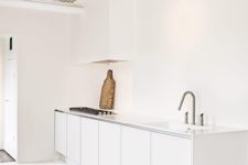 10 sleek minimalist kitchen with track lights over the countertop