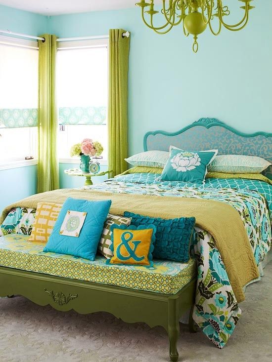 a chandelier, curtain and an ottoman done in lime green to keep the bedroom fashionable