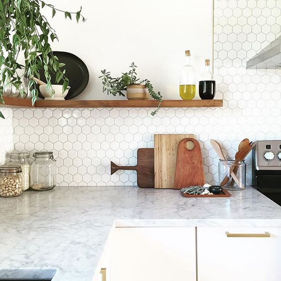 marble countertop and small hex tile backsplash