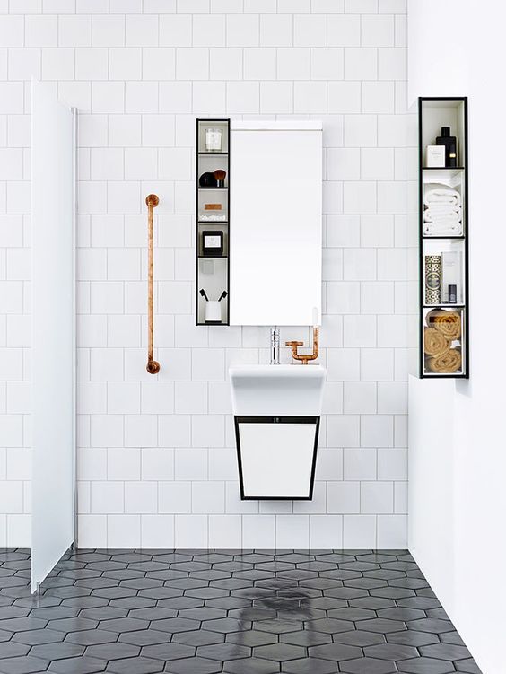 square white tiles and black hexagon tiles contrast in the shape and color